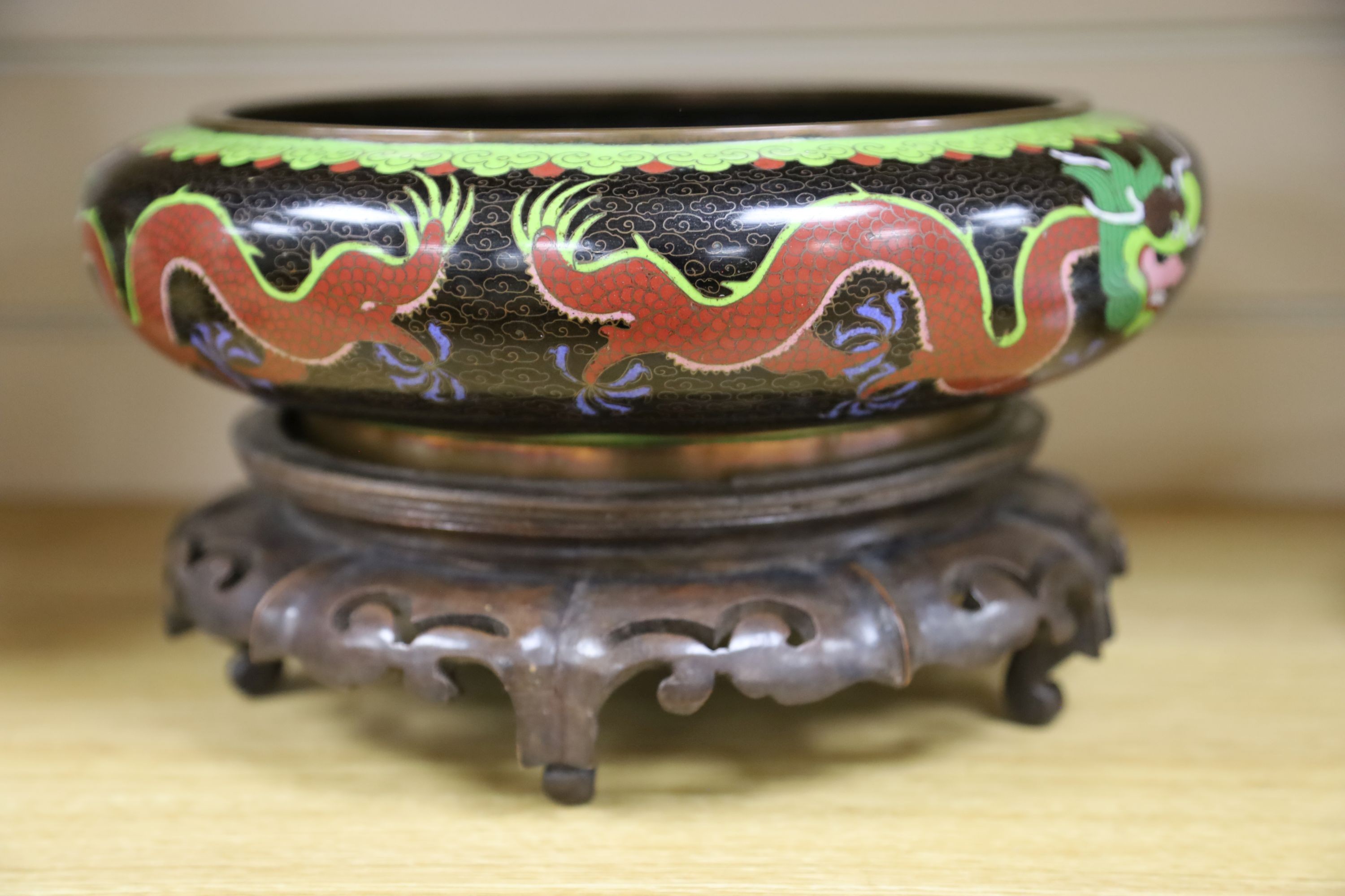 A large early 20th century Chinese cloisonné enamel ‘dragon’ bowl and two Chinese Tongzhi celadon ground famille rose bowls 31cm